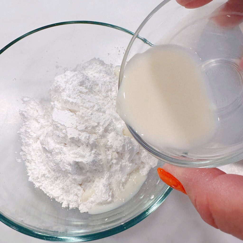 Mixing the glaze for the top of the cake.