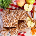 Apple Cider Crumb Cake on a board cut and ready to serve.