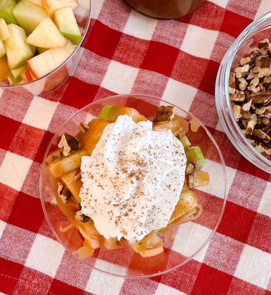 Caramel Apple in a cup with a delicious salted caramel sauce and whipped cream.