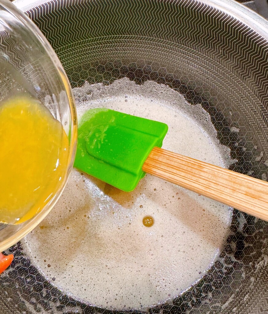 Making brown sugar and orange butter in a sauce pan over medium heat.