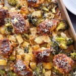 Sheet Pan Garlic Parmesan Chicken Thighs sprinkled with fresh parmesan.