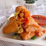 Egg rolls with dipping sauce. Sweet and sour.