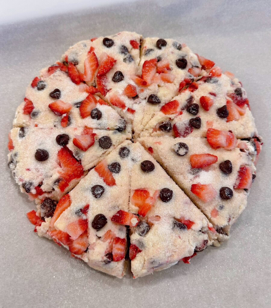 Dough disc cut into 8 individual triangles.