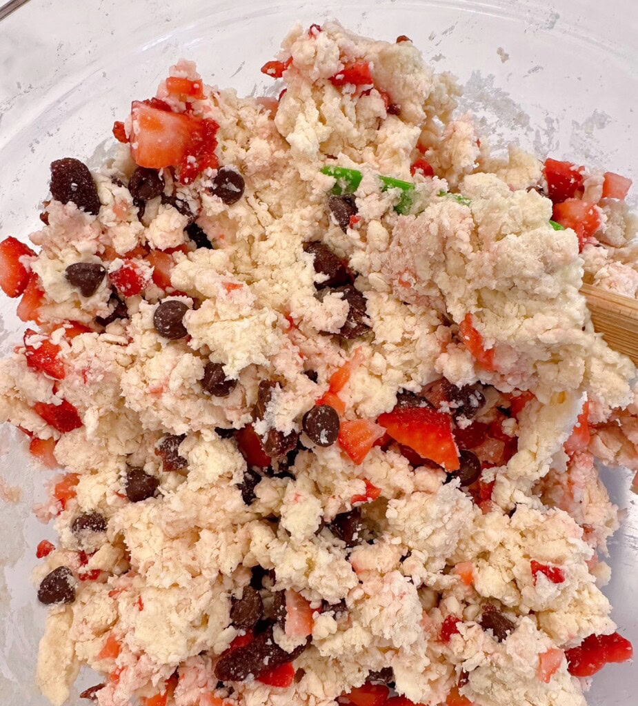 Strawberries and chocolate chips kneaded into scone dough.