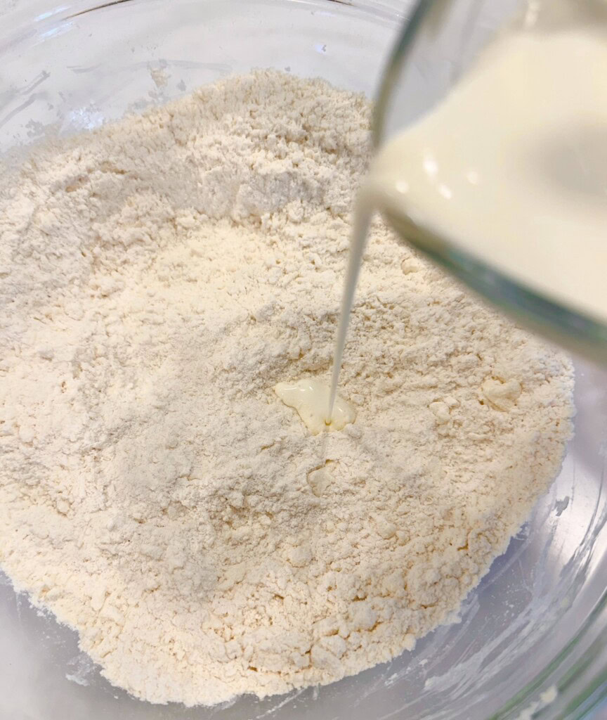 Adding "heavy cream" to dry ingredients.