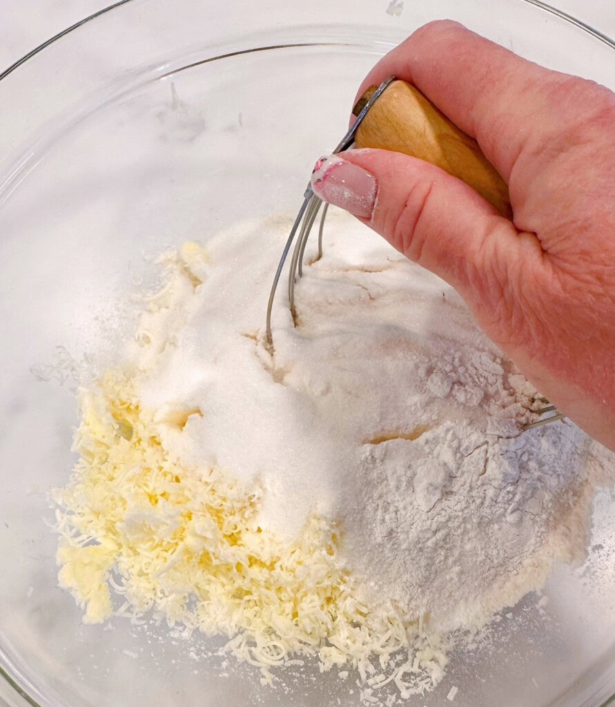 Cutting the flour mixture into the butter.