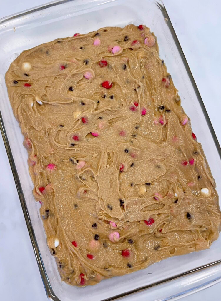Spread the Blondie batter in a prepared baking pan.