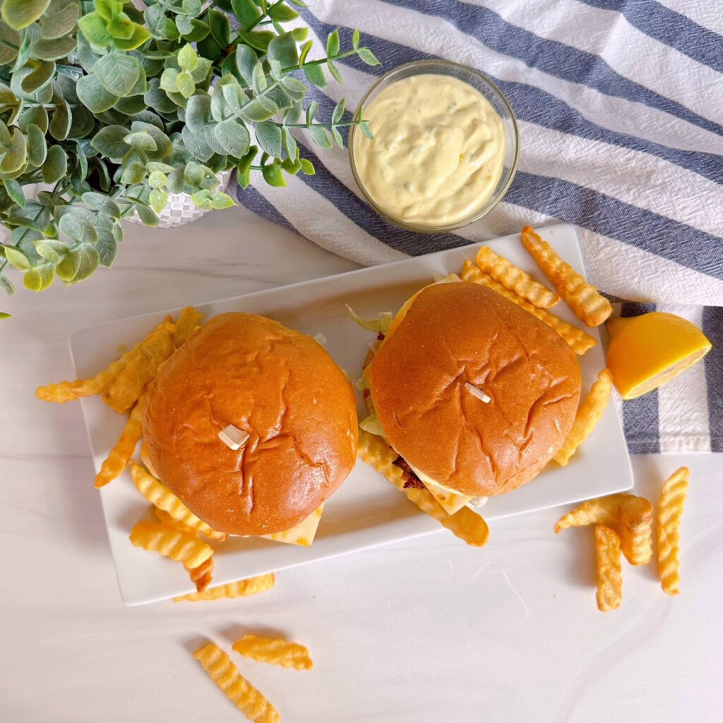 Fish sandwiches from above with fries and tartar sauce.
