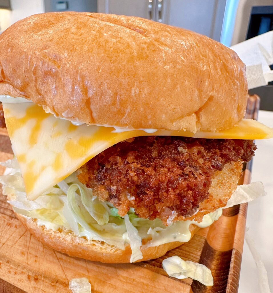 Assembled Fish Sandwich on a cutting board.