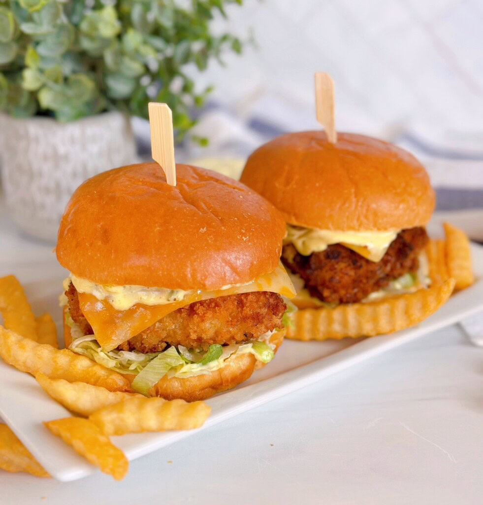 Filet-O-Fish copy cat sandwiches on a white plate with french fries.