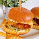 Fish sandwiches up close with tartar sauce.