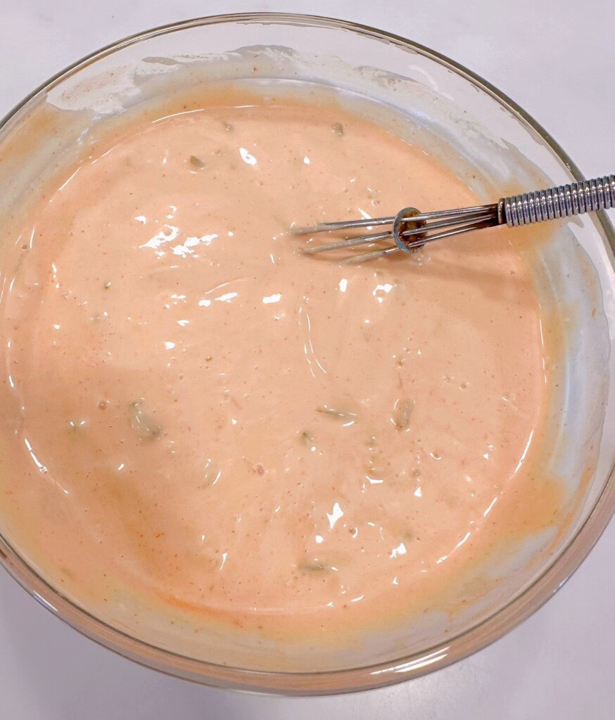 Sauce ingredients mixed together in a bowl.