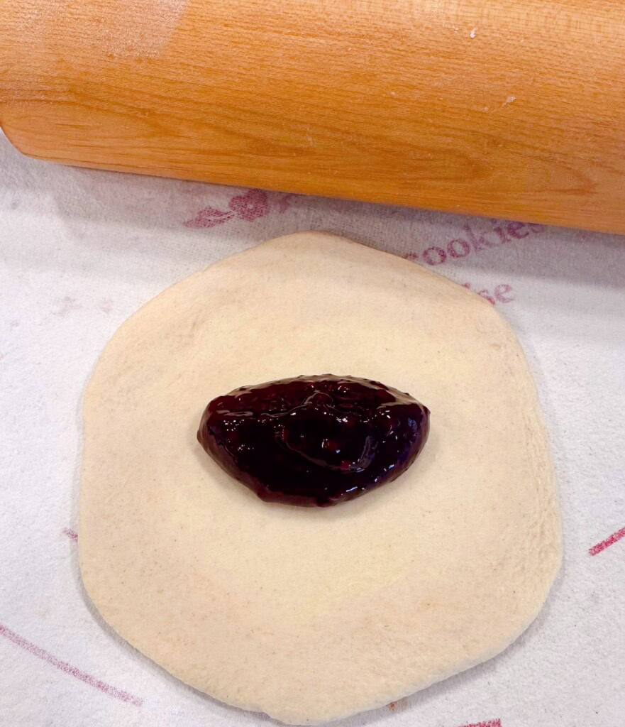 Pie filling in the center of each biscuit.
