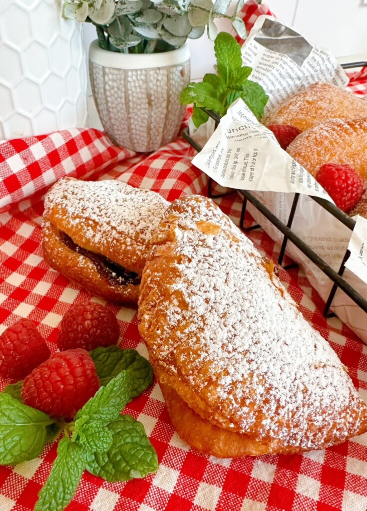 Hand pies with powdered sugar.