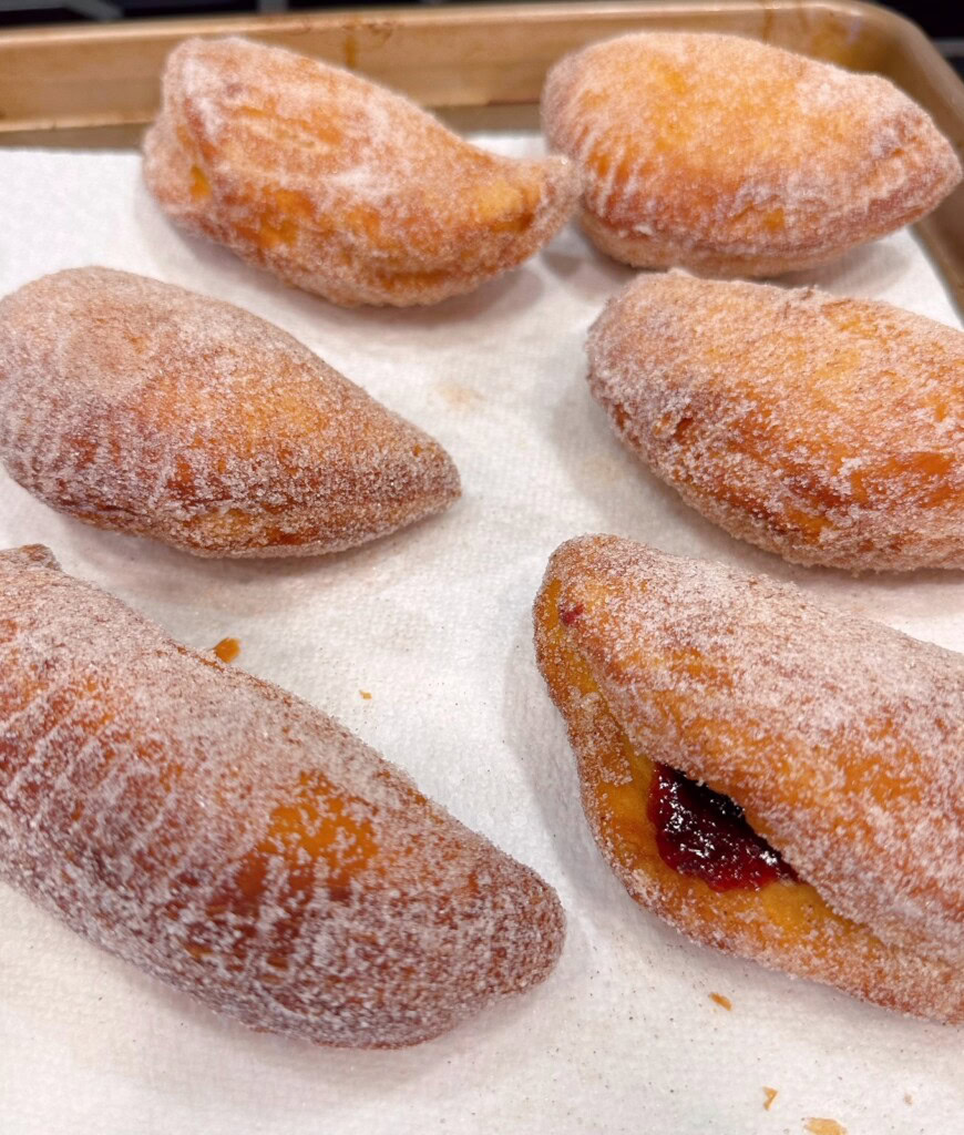 Fried Hand Pies on a paper towel lined baking sheet.