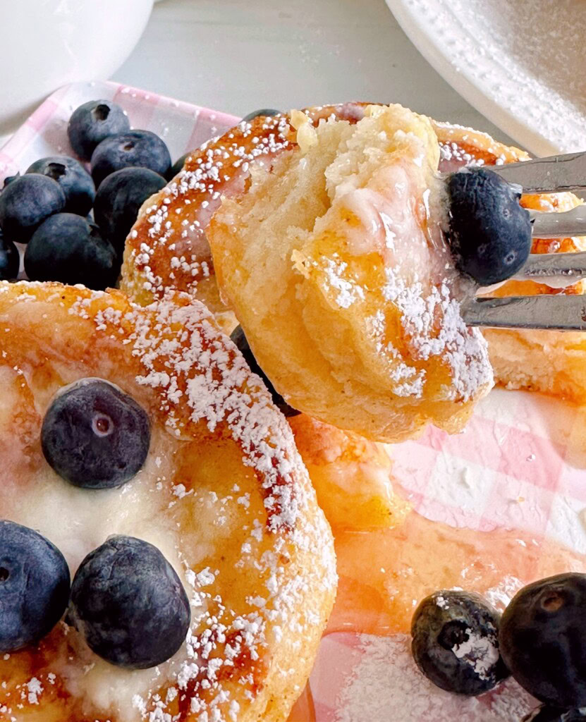 Biscuit French Toast cut and a portion on a fork.
