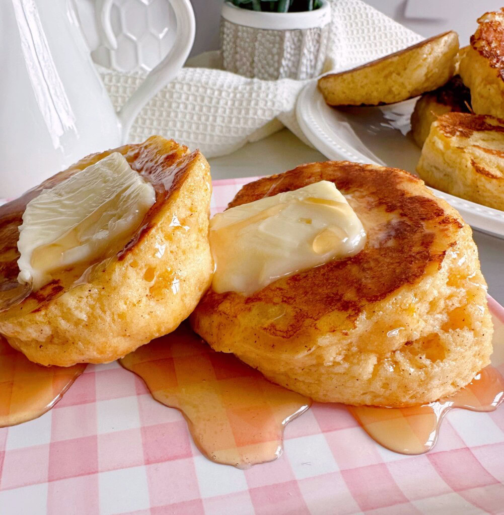 Biscuit French toast with butter and syrup.