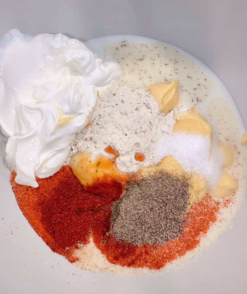 Wet ingredients for chicken hash brown casserole.