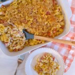 Ham and Noodle Casserole in the casserole and a serving on a dinner plate.