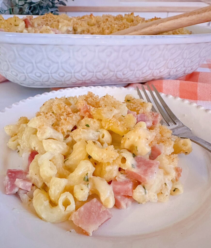 Ham and Noodle Casserole serving on a white dinner plate with a fork.