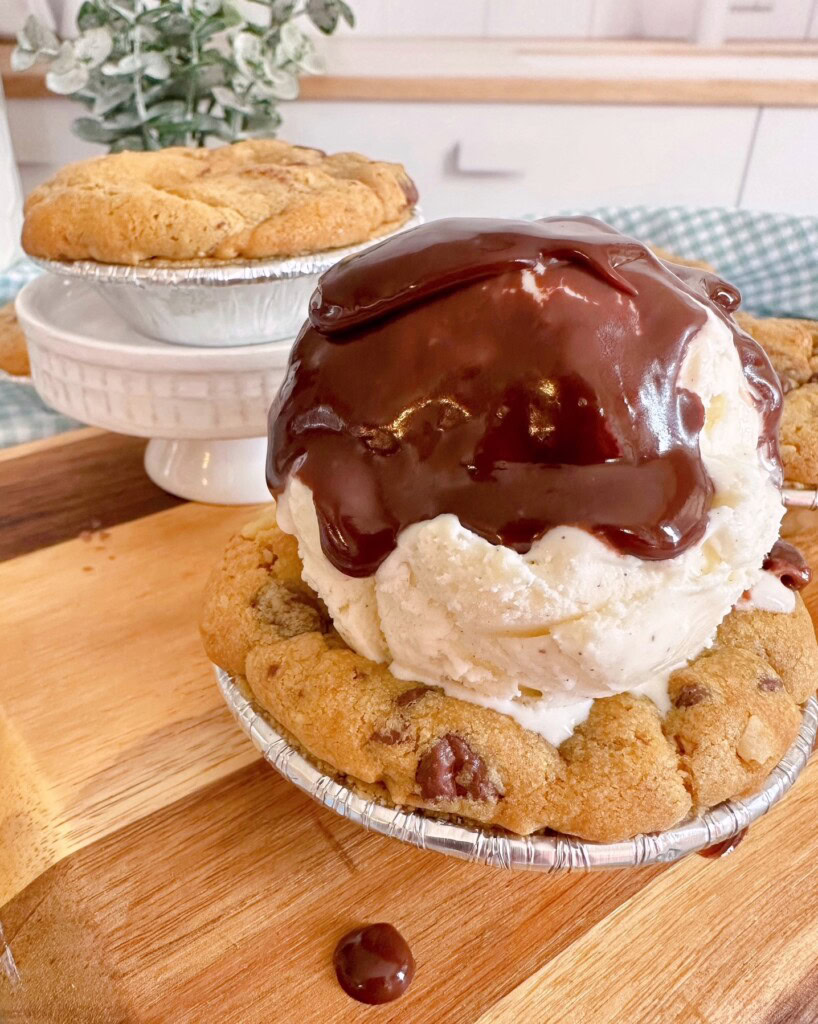 Mini S'mores pie with a scoop of ice cream and hot chocolate sauce.