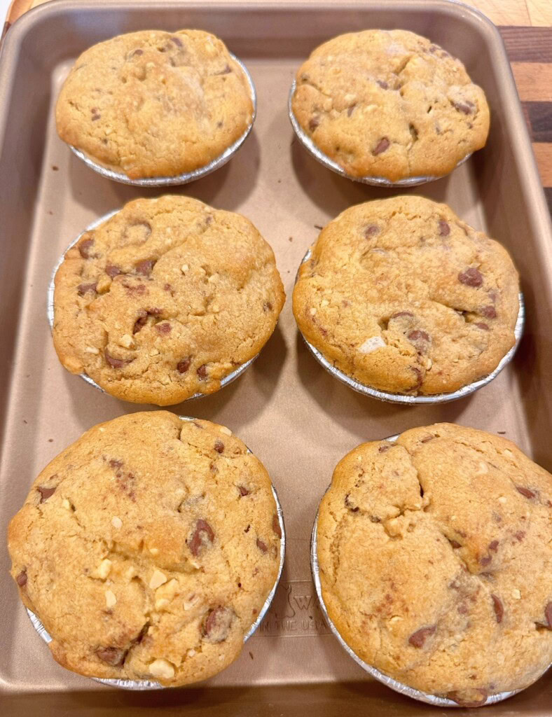 Cookie S'mores pies baked and on a baking sheet.