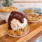 Mini S'mores Chocolate Chip Cookie Pies topped with Vanilla ice cream and homemade hot fudge sauce.