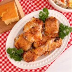 Serving chicken with cornbread and potato salad.