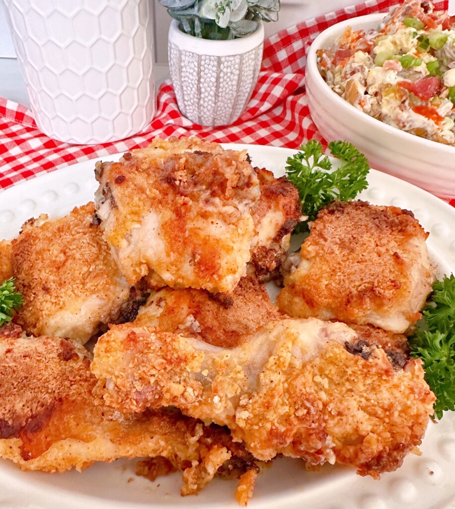 Oven Fried Chicken piled high on a dinner platter.