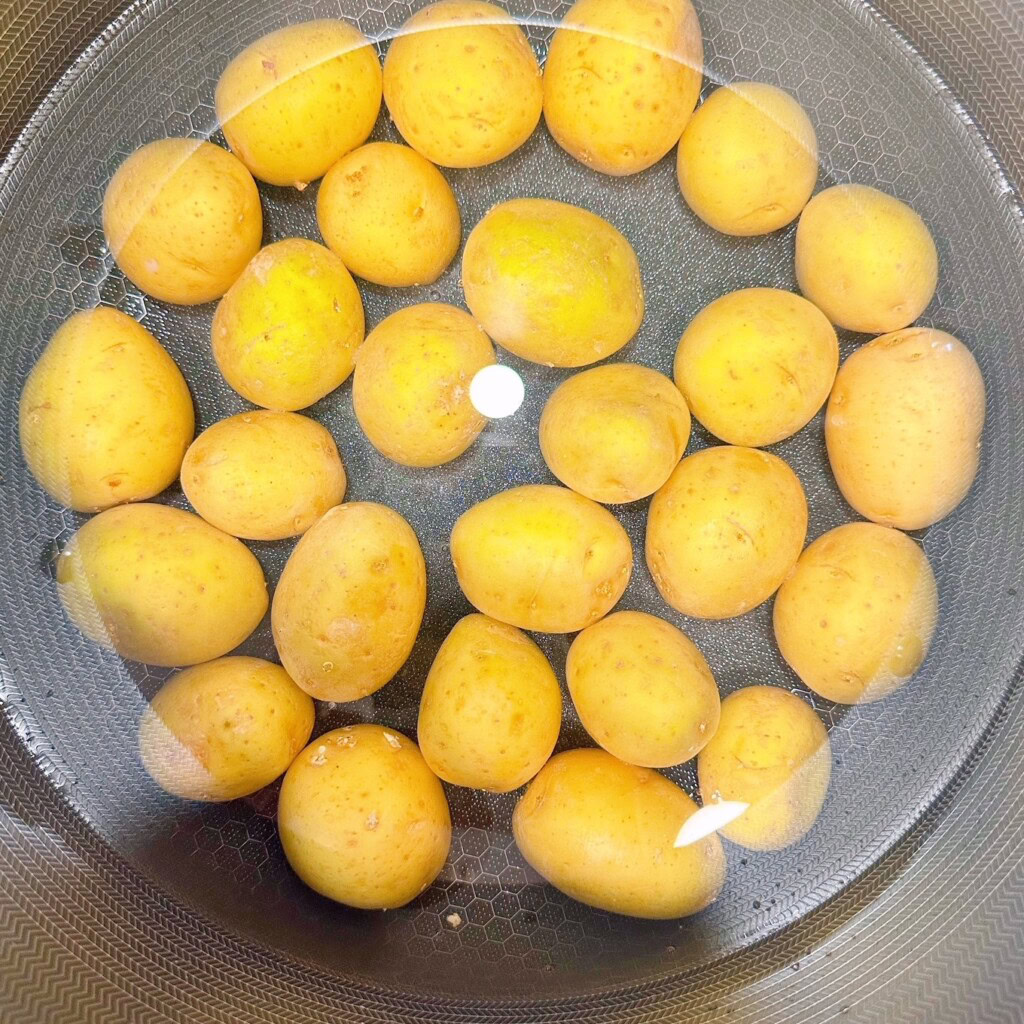 Potatoes in a large pot covered in water.