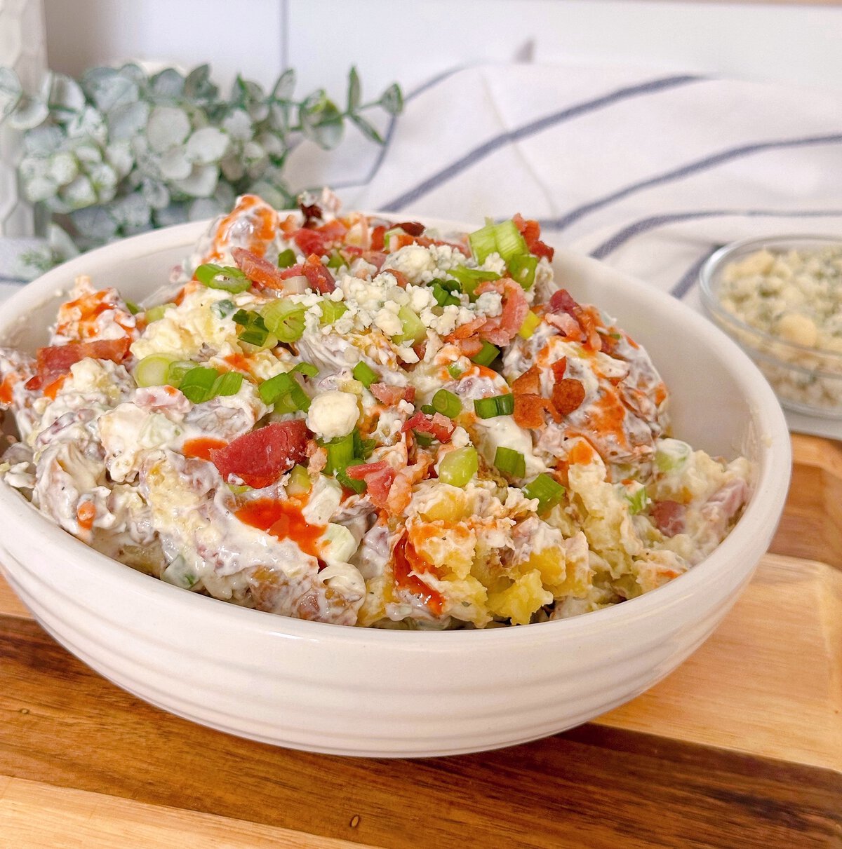 Smashed Crispy Potato Salad in a serving bowl.