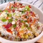 Smashed Buffalo Potato Salad in a white serving bowl.