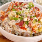 Buffalo blue cheese potato salad up close with buffalo sauce drizzle.
