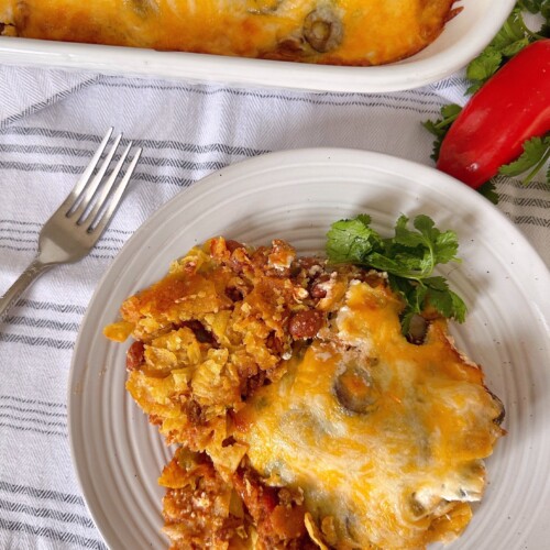 Taco Casserole on a serving plate with a fork.