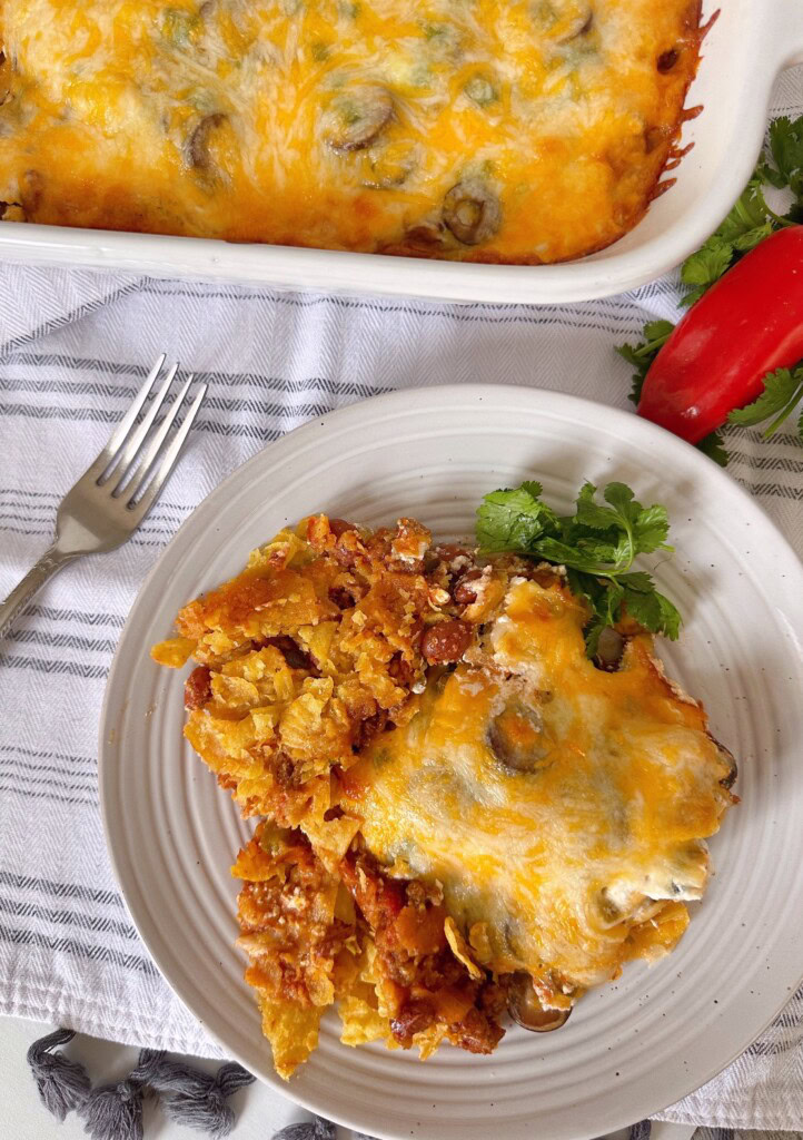 Taco Casserole on a serving plate with a fork.