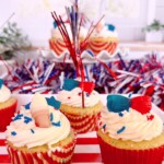 Tray full of patriotic 4th of july cupcakes.