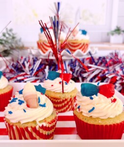 Tray full of patriotic 4th of july cupcakes.
