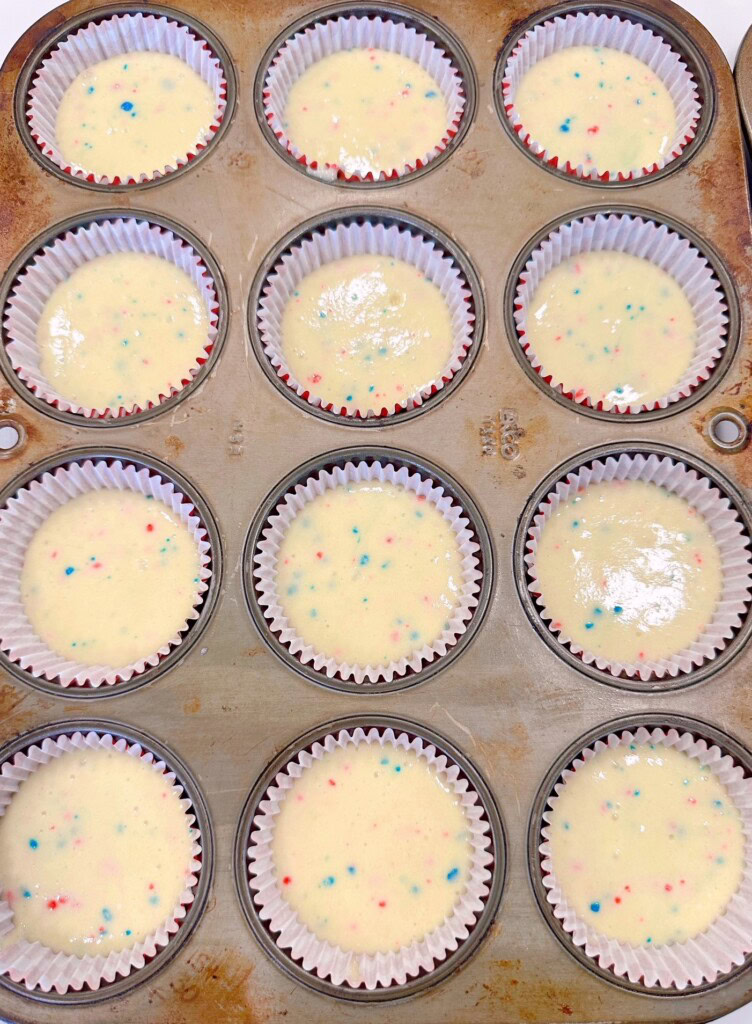 Cupcake liners filled with cake batter.