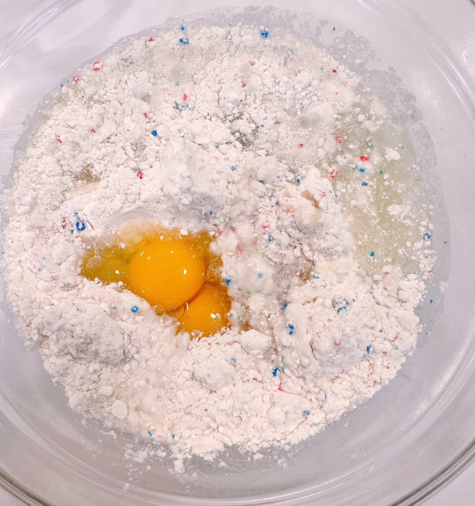 Cake mix ingredients in a large bowl.