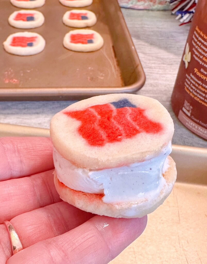 Top and bottom sugar cookie with ice cream in the center.