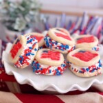 4th of July Pillsbury Sugar Cookie Ice Cream Sandwiches piled high on a white serving plate.