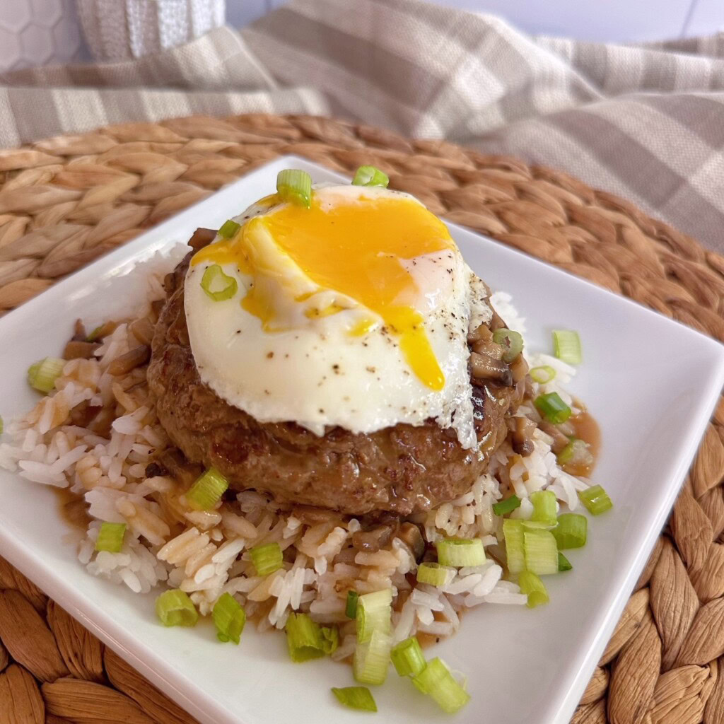 Loco Moco on a bed of rice with lots of rich gravy.