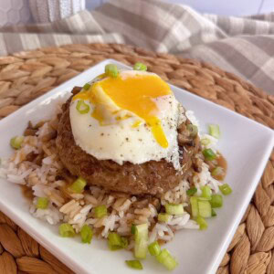 Loco Moco on a bed of rice with lots of rich gravy.