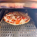 Pizza baking in the Ninja Pizza Oven.