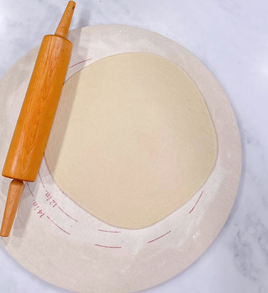 Dough rolled into a 12-inch circle.