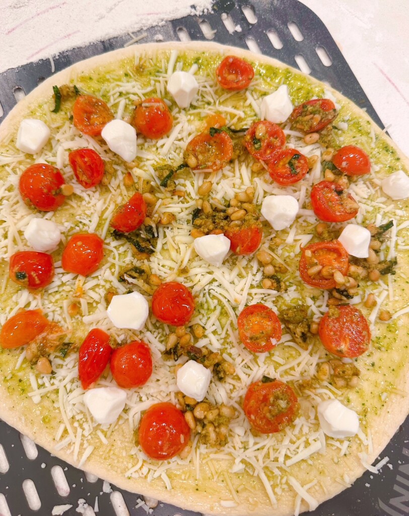 Tomato and basil sauce with pearl mozzarella balls.