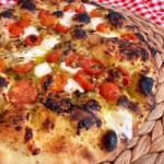 Baked fresh tomato and basil pizza.
