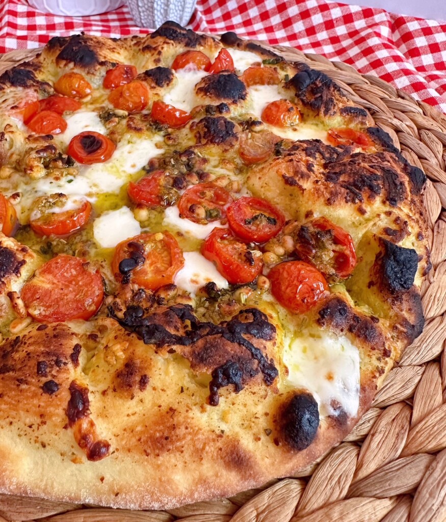 Baked fresh tomato and basil pizza.