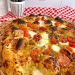 Photo of baked tomato and basil pizza.
