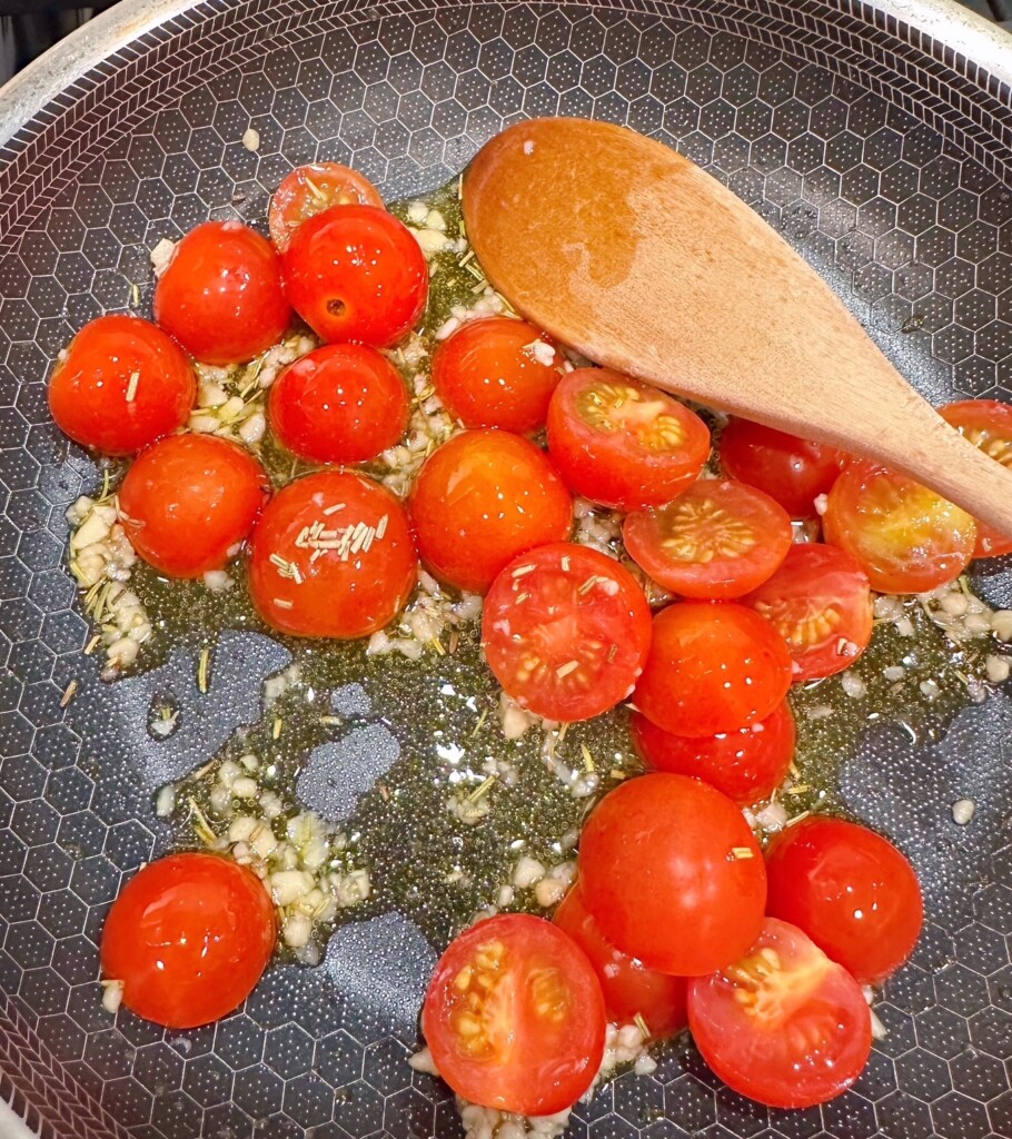 Saute the tomatoes until the skin blisters.